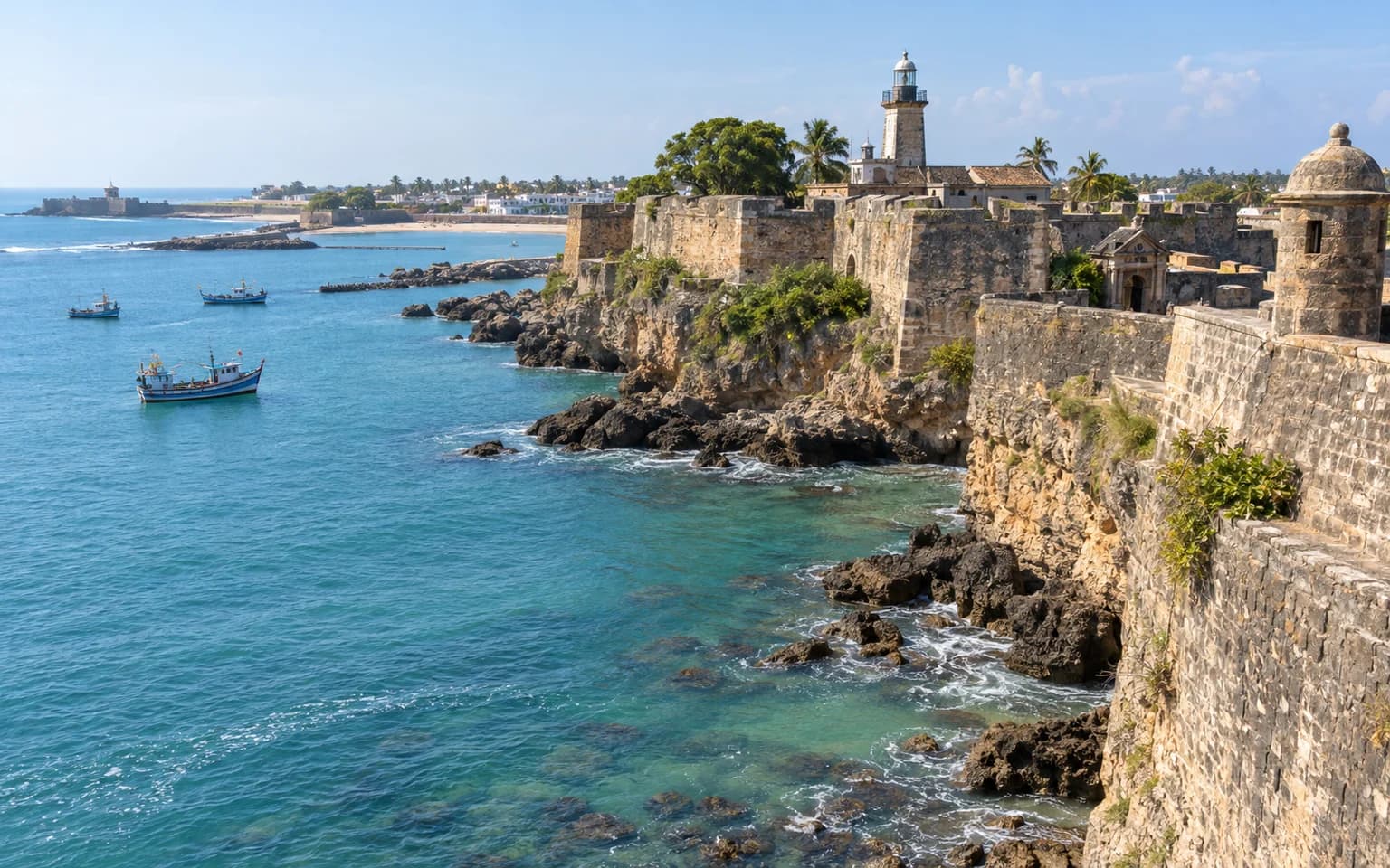 Historic Diu Fort and lighthouse above the blue Arabian Sea