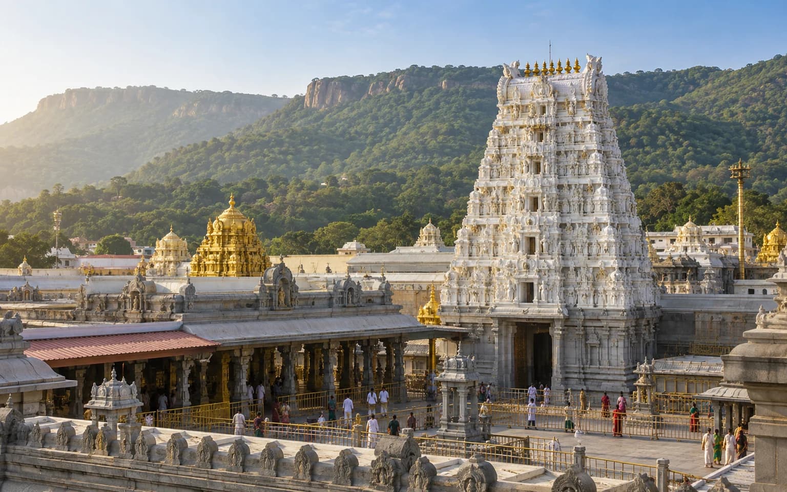 A temple gateway and forested hills at Tirumala
